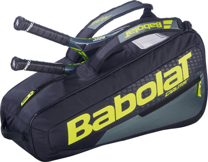 The Babolat RH Carlitos Junior 3 Racket Tennis Bag in black/yellow features a large Babolat logo and spacious zippered main compartment, perfect for young players to carry their gear.