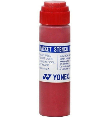 The Yonex Stencil Ink - Red bottle comes with a convenient sponge applicator under its cap. The label recommends shaking well before applying the ink to racket strings and displays important cautionary information. It is proudly made in the USA.