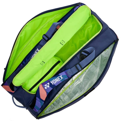 The Yonex 92429EX 9 Racket Pro Tennis Bag - Midnight Navy features multiple compartments, Yonex logo straps, a bright green interior, and Thermo Guard technology to protect your rackets and equipment.