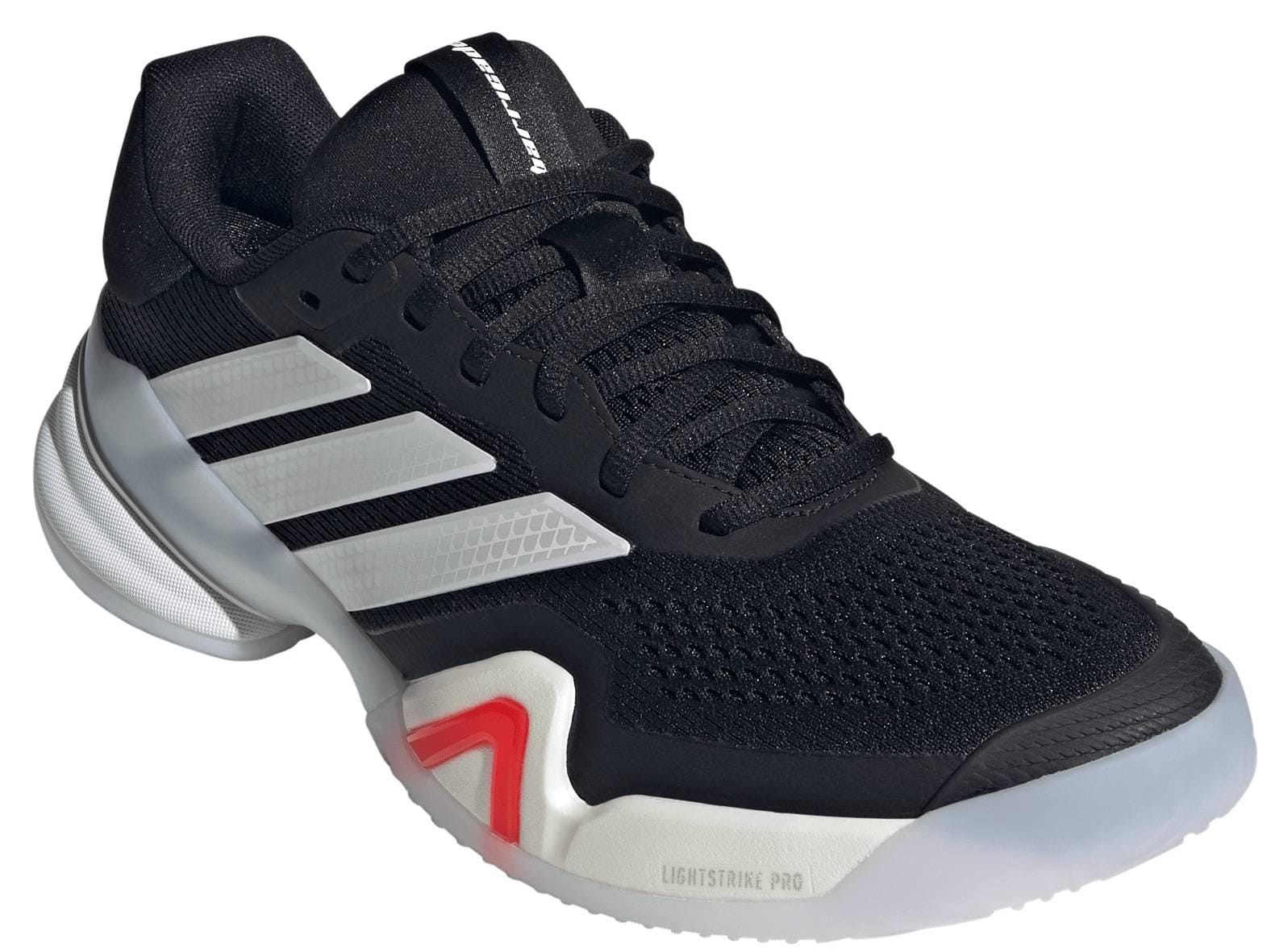 The adidas ADIDAS Barricade 14 Men's Tennis Shoes in black feature white stripes, a white and translucent sole, red toe accents, and mesh detailing—offering reliable performance for men on the court.