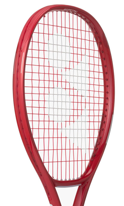 A close-up of the Yonex VCORE 25 Junior Ruby Red 2026 Tennis Racket with white and red strings and the stylized “YY” logo on the graphite string bed.