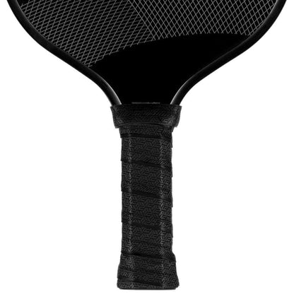 Close-up of the Lizard Skin DSP Ultra Pickleball Grip 0.8mm in Jet Black, showcasing its textured grip by Lizard Skin for enhanced tackiness and durability, plus a glimpse of the paddle face with a crisscross pattern.