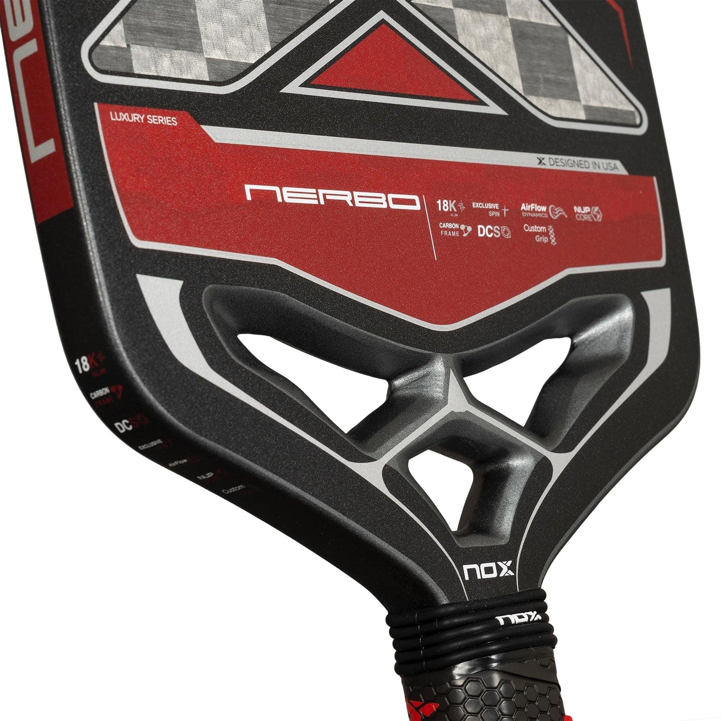 Close-up of the NOX Luxury Nerbo Pickleball Paddle in black and red, showcasing geometric patterns, branding, technical details, and Exclusive Spin technology for enhanced control and performance.