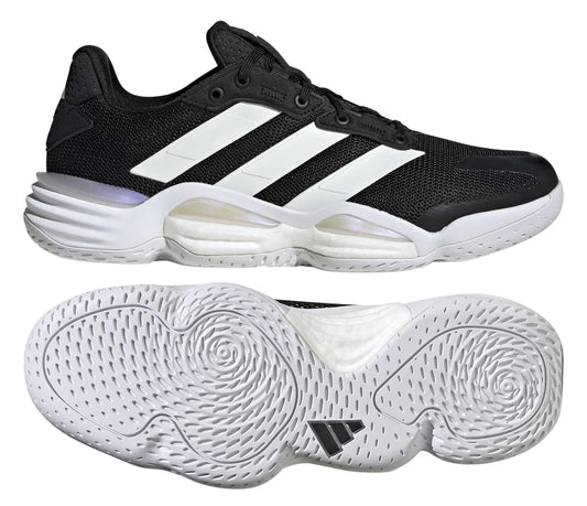 Discover the unrivaled comfort of ADIDAS Stabil 16 Men's Indoor Court Shoes in black, boasting a unique three-stripe design with white accents. Enjoy the ultimate support from its BOOST midsole and circular-patterned sole for better grip, perfect for active sports.