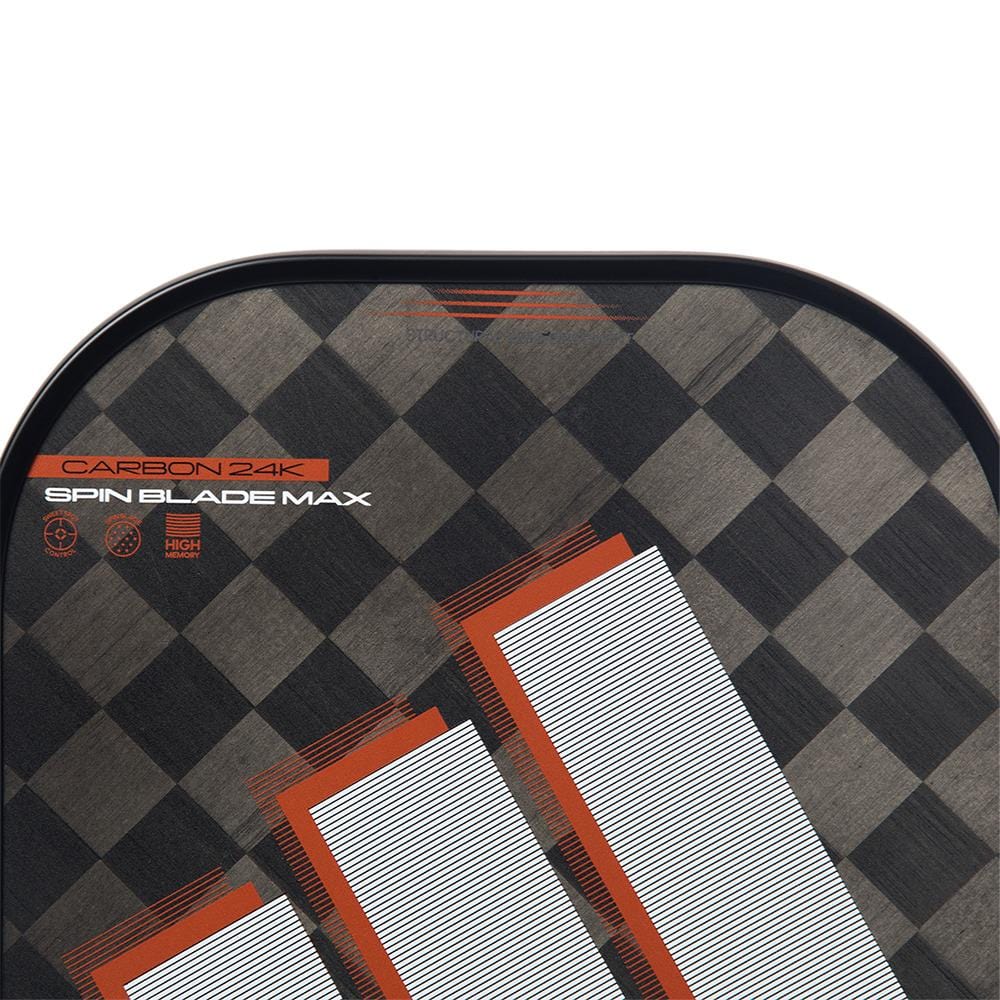 Close-up of the adidas ADIDAS Adipower CTRL 3.3 Pickleball Paddle - Black / Orange, featuring a black and gray checkered pattern, bold white/orange stripes, "CARBON 24K," "SPIN BLADE MAX," and icons highlighting its 24K aluminized carbon surface.