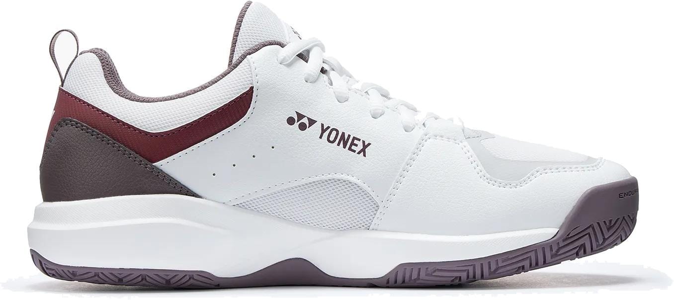 The Yonex Pro-Move Classic WIDE Men's Tennis Shoe in white and red features Power Cushion technology, a lace-up design, cushioned sole, and a textured outsole for improved grip, shown from the side.