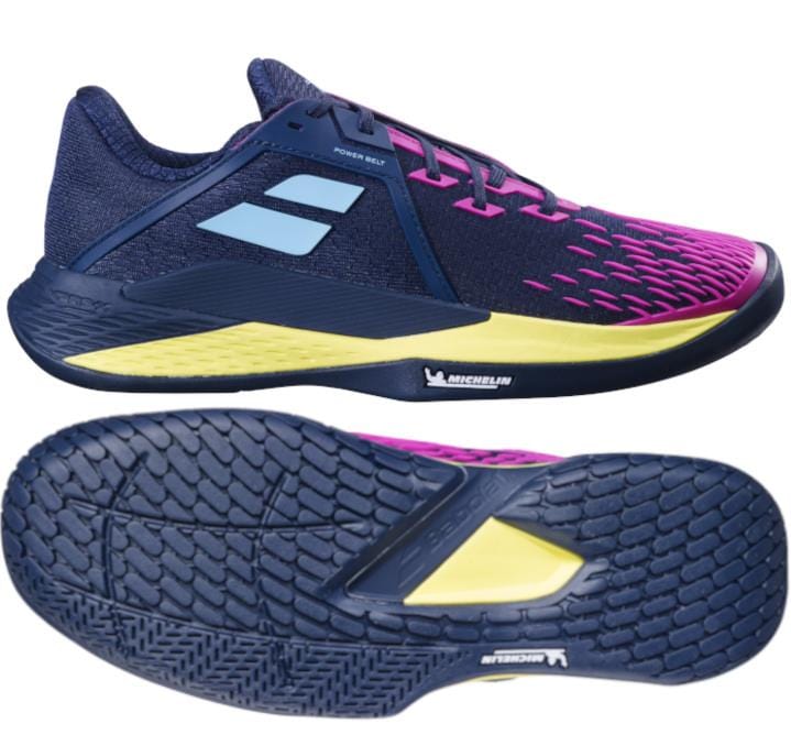 A side and bottom view of the Babolat Propulse Fury 3 2024 Men's Tennis Shoes in Dark Blue and Pink Aero highlights their sleek athletic design. These tennis shoes feature a textured sole for enhanced grip, yellow accents, and a prominent logo on the side. The intricate patterns provide superior traction, while excellent shock absorption makes them ideal for athletes.
