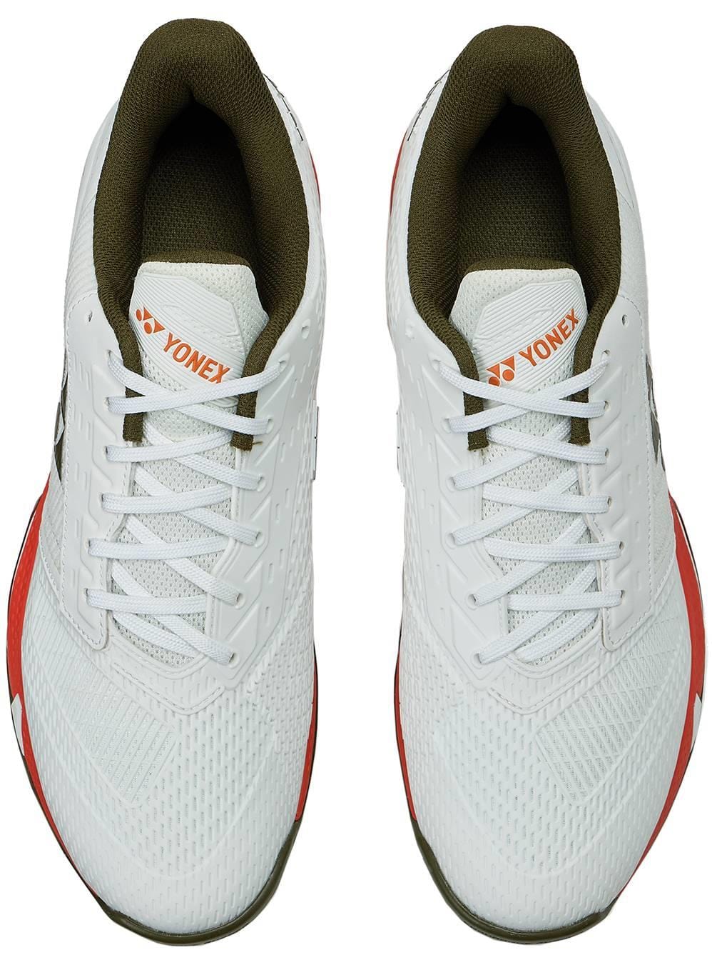 The Yonex Power Cushion Ad-Accel Men's Tennis Shoes in White/Orange feature a white mesh upper, olive green inner lining, and orange accents—designed for fast, agile court movement.