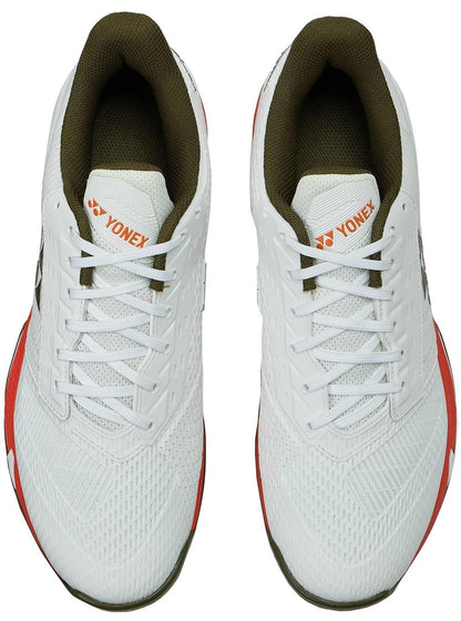 The Yonex Power Cushion Ad-Accel Men's Tennis Shoes in White/Orange feature a white mesh upper, olive green inner lining, and orange accents—designed for fast, agile court movement.