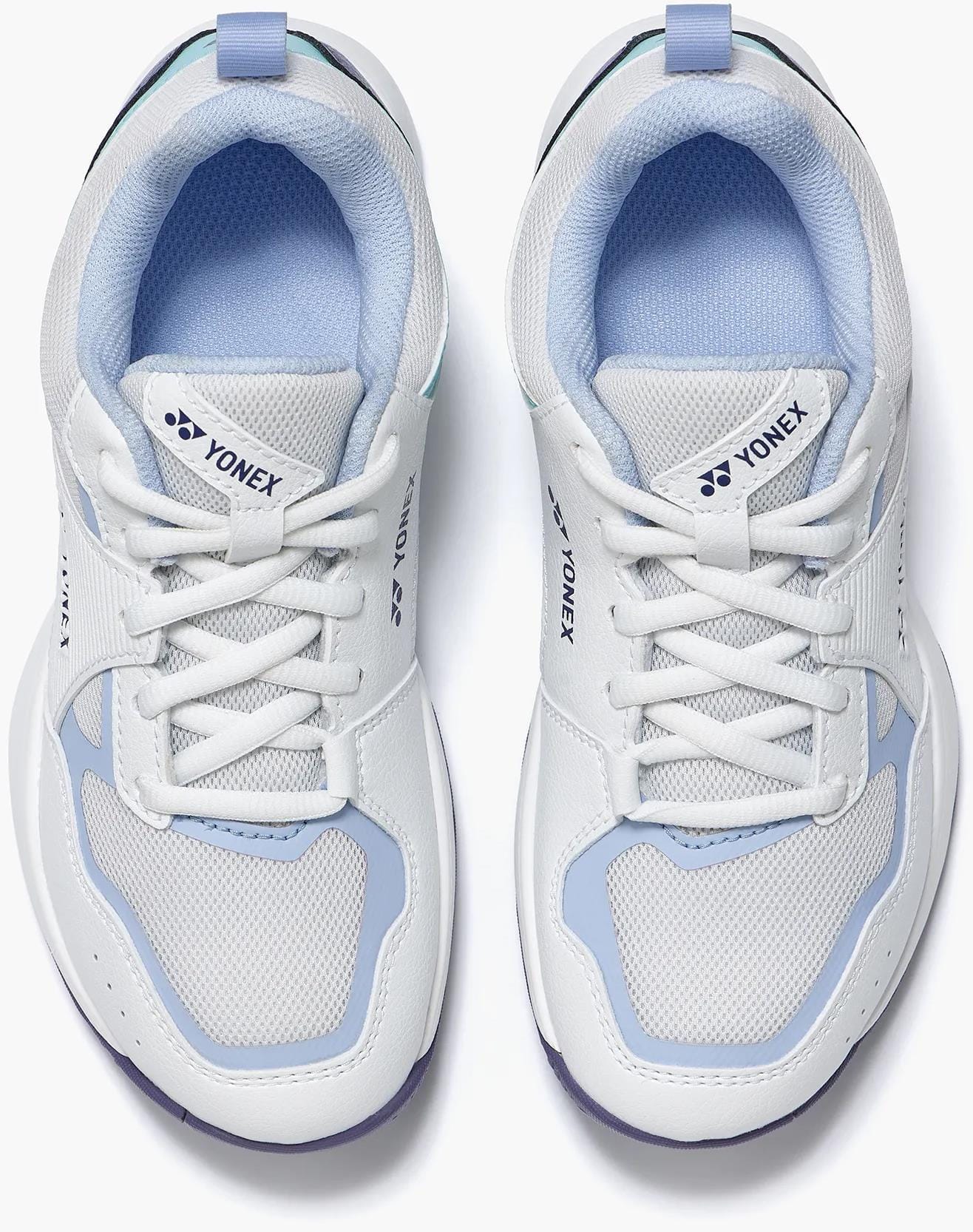 A pair of Yonex Pro-Move Classic Junior Tennis Shoes in White/Sax with breathable mesh panels, white laces, and Power Cushion Technology, shown from above on a plain background.