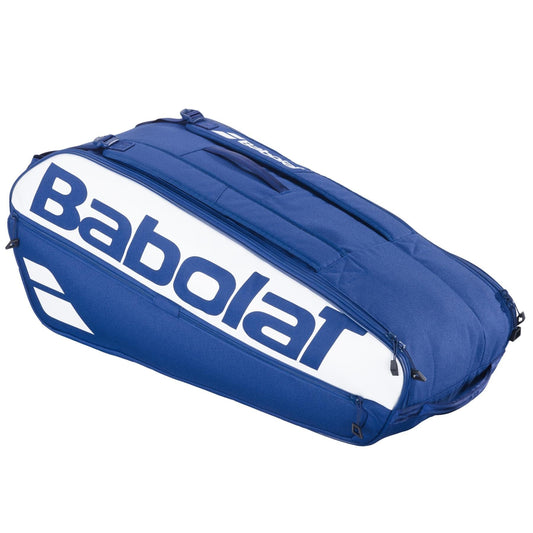 The Babolat Court L 9 Racket Tennis Bag in dark blue features multiple compartments, zippers, and a large Babolat logo—ideal for carrying your tennis gear stylishly and securely.