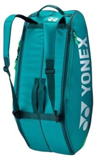 The Yonex 92426EX 6 Racket Pro Tennis Bag in dark green features the Yonex logo on the side, two shoulder straps, and a zippered compartment—ideal for carrying rackets and sports equipment.