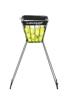 A black collapsible ball hopper called the "Dunlop 70 Tennis Ball Hopper" is filled with yellow tennis balls and is supported by four sturdy metal legs.