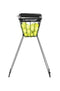 A black collapsible ball hopper called the "Dunlop 70 Tennis Ball Hopper" is filled with yellow tennis balls and is supported by four sturdy metal legs.