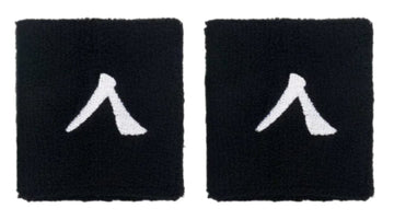 Two black fabric Kanso 7cm wristbands feature white minimalistic human figures, set on a plain white background. Made from absorbent fabric for comfort, these patches capture the simple essence of the Kanso brand.