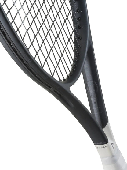 Close-up of the HEAD Speed MP L 2026 Tennis Racket by HEAD, highlighting its black and white design, visible text, logo, strings, part of the frame, and Auxetic 2.0 technology details.
