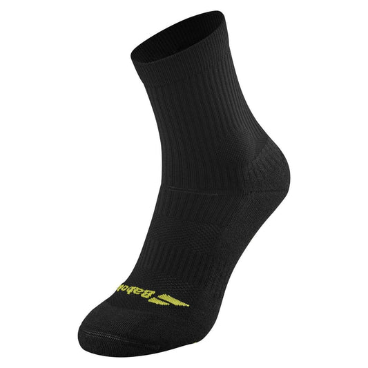 Introducing the Babolat Pro 360 Men's Sock in Black/Aero: This mid-calf, black athletic sock boasts a ribbed texture and incorporates FiberDry technology for optimal comfort. Subtle yellow Babolat branding near the toe enhances its detailed stitching and underfoot cushioning. Set against a white background, this sock promises both support and style.