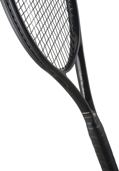 Close-up of the HEAD Speed Pro Legend 2025 Tennis Racket - Black / Gold by HEAD, highlighting its strings, frame, and grip, shown diagonally against a white background.