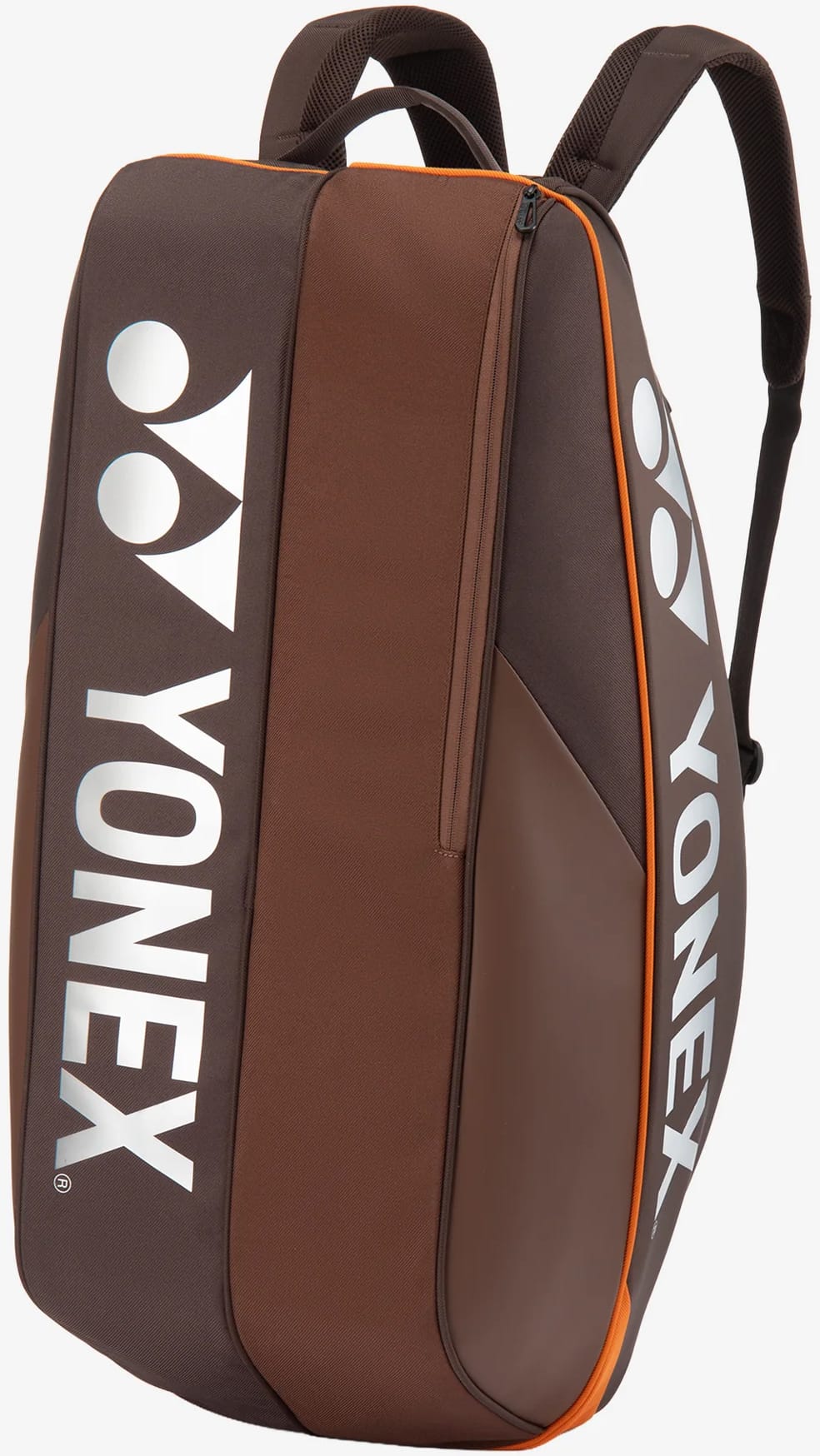 The Yonex 92426EX 6 Racket Pro Tennis Bag in Espresso Brown features orange trim, white Yonex logos, a convenient side zipper pocket, and two adjustable shoulder straps. Designed as a versatile tennis bag by Yonex, it offers enough space to carry up to six rackets and is pictured standing upright against a light background.