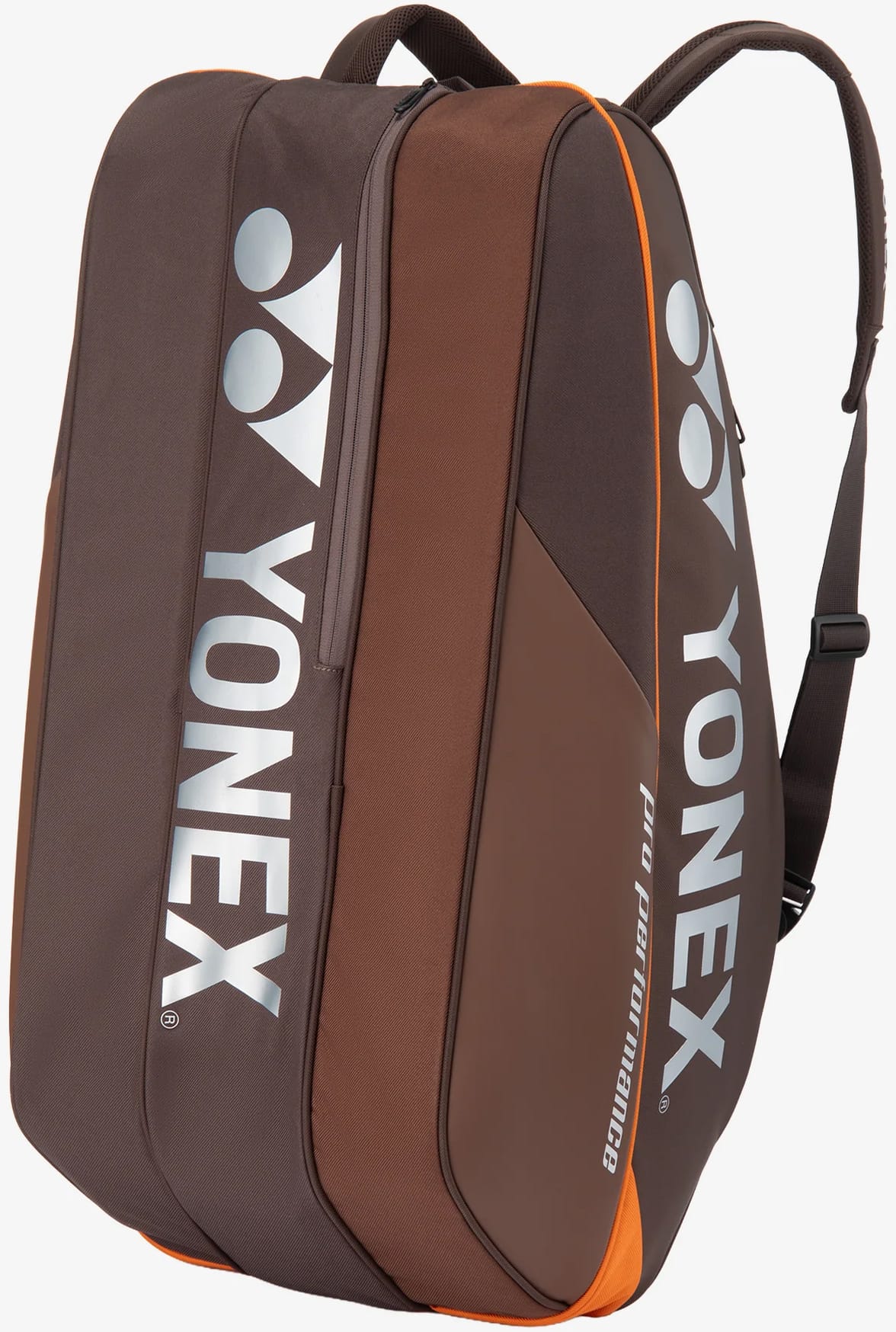 The Yonex 92429EX 9 Racket Pro Tennis Bag in Espresso Brown features two shoulder straps, prominent white Yonex logos, and orange accents. Designed to securely and conveniently carry tennis equipment, this bag offers multiple compartments and can hold up to nine rackets.