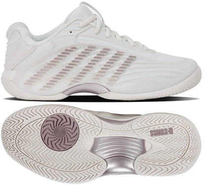 Two views of the K-Swiss Hypercourt Express 3 Women's Tennis Shoes in White and Rose Gold: a side profile highlights the wavy lines and striped detailing, while the bottom view showcases a textured sole with circular patterns and rose gold metallic accents. These K-Swiss tennis shoes blend performance technology with elegant style, boosting on-court confidence.