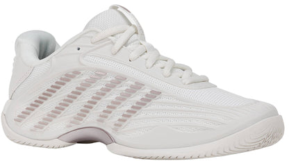 The K-Swiss Hypercourt Express 3 Women’s Tennis Shoes in White/Rose Gold are designed for women and feature a breathable mesh upper, a textured sole, and stylish rose gold accents on the side and midsole. Shown at an angle highlighting the outer side and front, these athletic sneakers incorporate K-Swiss's Surgelite+ midsole for superior cushioning and comfort during play.