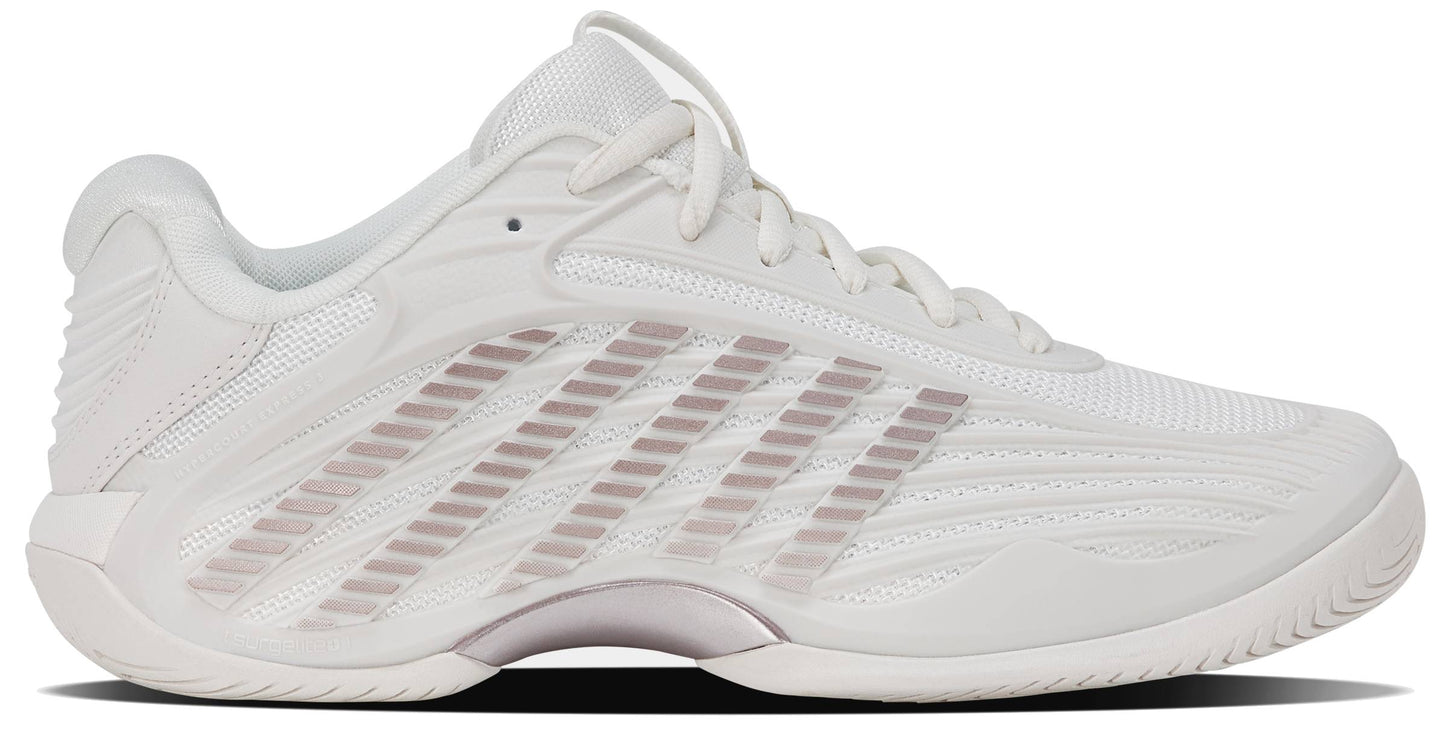 The K-Swiss Hypercourt Express 3 Women's Tennis Shoes in White/Rose Gold are inspired by classic women's tennis sneakers, featuring a breathable mesh upper, textured side detailing, white laces, and a slightly chunky sole. Light rose gold accents add a modern touch to the streamlined design, making these shoes perfect for both on-court performance and off-court style.