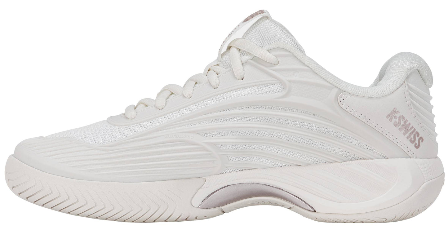The K-Swiss Hypercourt Express 3 Womens Tennis Shoes in White / Rose Gold feature a white athletic silhouette with textured detailing, white laces, and a subtle light pink "K-SWISS" logo on the heel. Viewed from the side against a white background, this stylish and comfortable design is perfect for women seeking premium performance tennis shoes from K-Swiss.