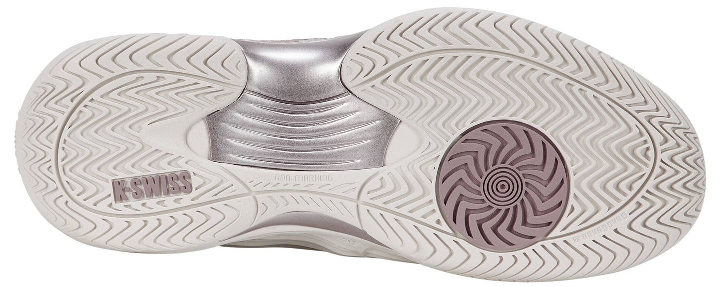 The image features the sole of the K-Swiss Hypercourt Express 3 Womens Tennis Shoes in White / Rose Gold, showcasing wavy traction patterns and an embossed K-Swiss logo near the heel, emphasizing its status as a top women's tennis shoe.