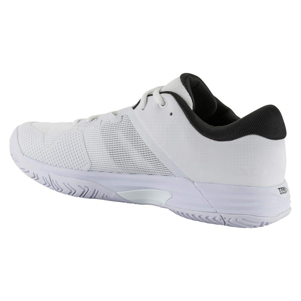 The HEAD Revolt Evo 2.0 Men's Wide Fit Tennis Shoes in White/Black feature a sleek design with a textured sole and black inner lining, seen from the back and side angle. These stylish athletic shoes offer a lace-up closure and mesh details for optimal breathability, making them ideal for any tennis match.