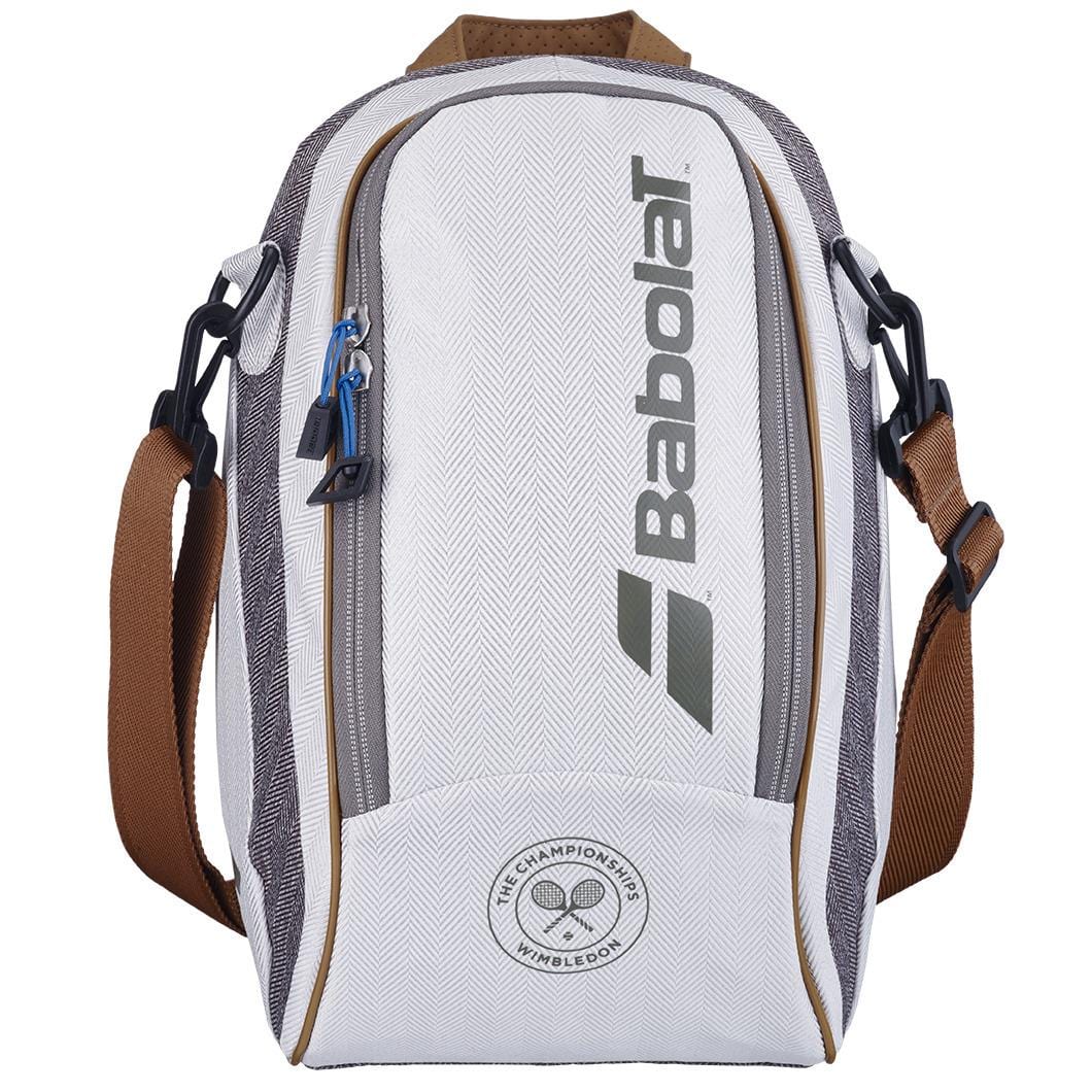A grey Babolat Wimbledon Cooler Tennis Bag with a large central zipper and a side pocket. It showcases the iconic Wimbledon colors along with the Babolat logo and Wimbledon branding. The bag comes with adjustable brown shoulder straps and black attachments.