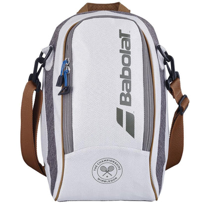A grey Babolat Wimbledon Cooler Tennis Bag with a large central zipper and a side pocket. It showcases the iconic Wimbledon colors along with the Babolat logo and Wimbledon branding. The bag comes with adjustable brown shoulder straps and black attachments.