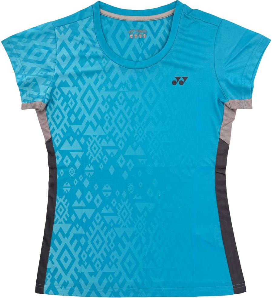 The Yonex YTL11 Womens Tennis T-Shirt - Blue Sea is a short-sleeved, lightweight performance tee with geometric patterns, black side panels, grey accents, and a small left chest logo for quick-drying comfort on the court.