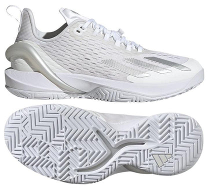 The adidas Adizero Cybersonic Women's Tennis Shoes in White/Silver are displayed from a side angle and bottom view, emphasizing their sleek mesh upper with textured panels and unique geometric tread pattern tailored for enhanced speed on the court.