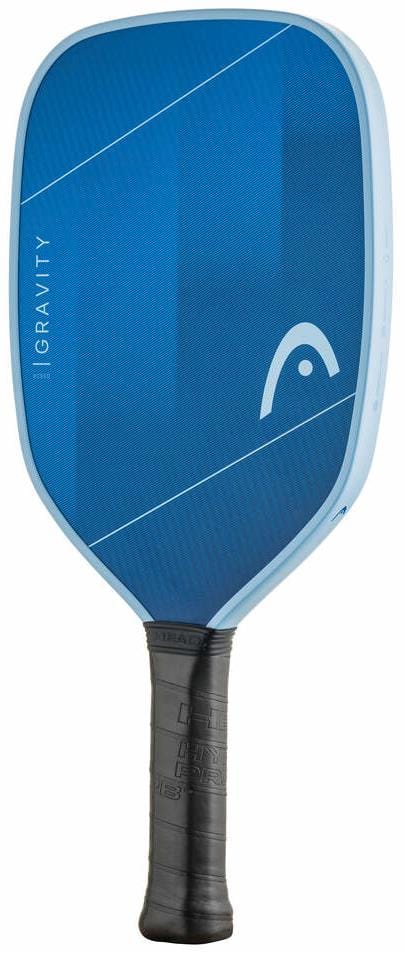 The HEAD Gravity XCEED 2026 Pickleball Paddle features a blue fibreglass surface, light blue edge, black grip, "GRAVITY" vertically on the left, and a white HEAD logo near the top right.