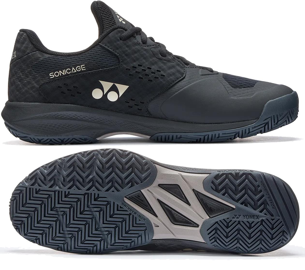 A pair of Yonex Power Cushion Sonicage Men's Tennis Shoes in Black/Mocha Grey is shown from the side and bottom, featuring the Yonex logo, mesh details, and a zigzag textured sole for lightweight comfort.
