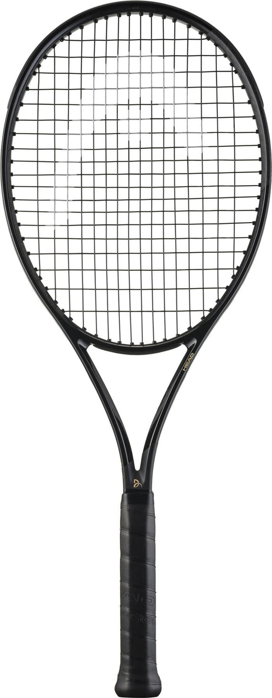 The HEAD Speed MP Legend 2025 Tennis Racket in black and gold, inspired by Novak Djokovic, features a dark handle and tightly strung strings, shown against a white background.