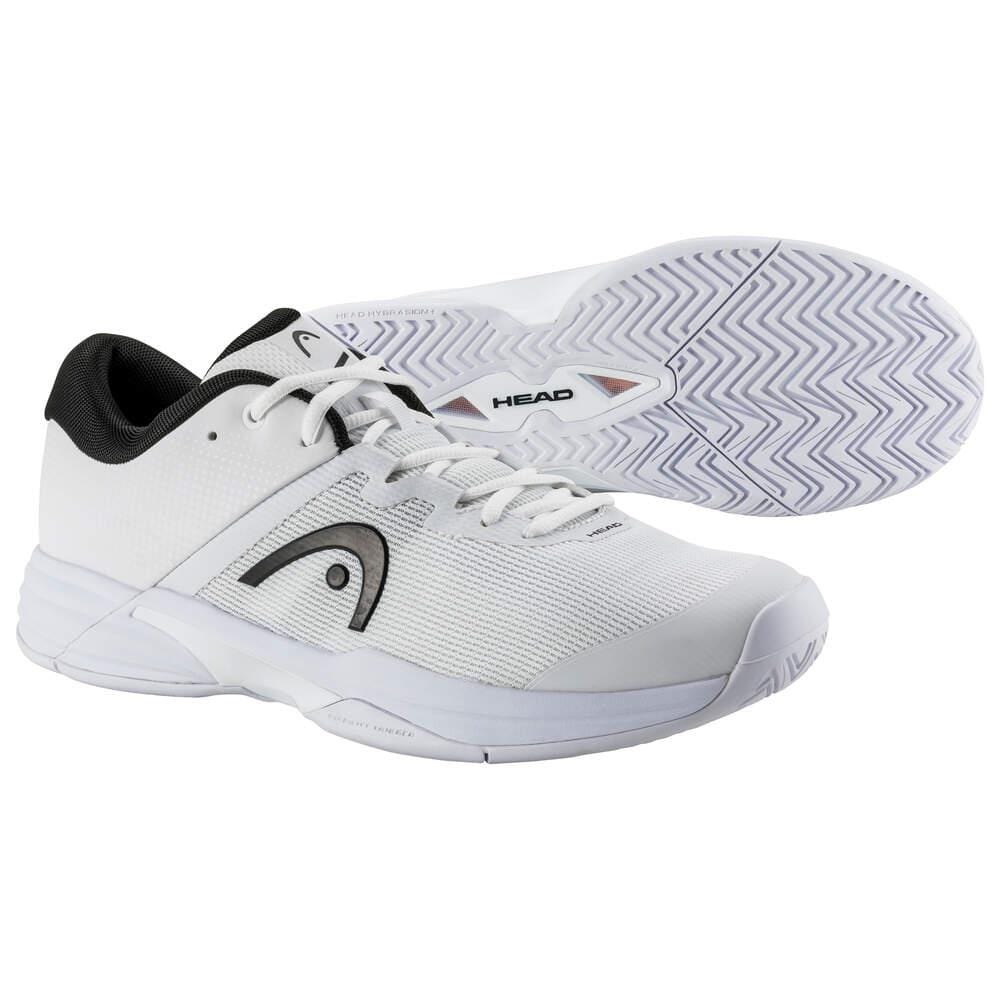 A pair of HEAD Revolt Evo 2.0 Men's Wide Fit Tennis Shoes features a stylish white design accented with black and gray. One shoe is positioned upright, prominently displaying the side view adorned with the HEAD logo, while the other showcases an intricate zigzag pattern on its sole.