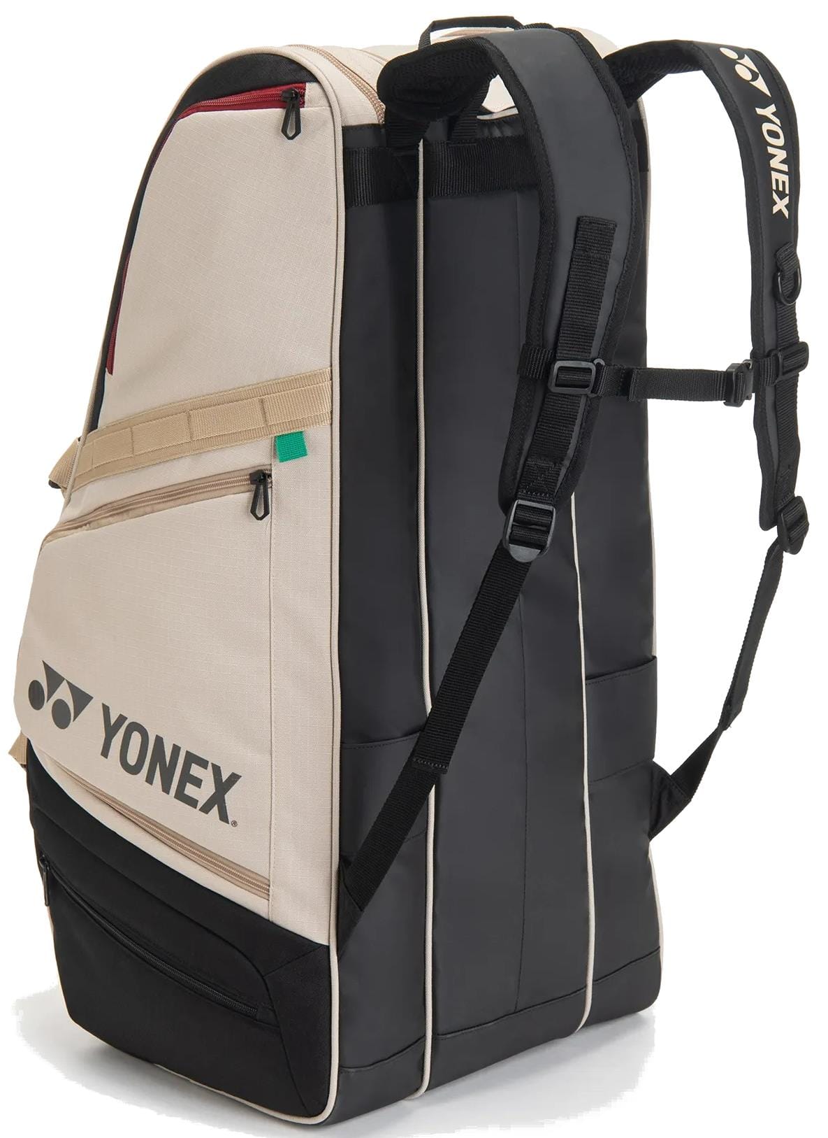 The Yonex BA72629EX Gearlogic 9 Racket Tennis Bag in beige features multiple zippered compartments, padded straps, and Yonex branding—ideal for carrying sports gear and up to 9 rackets to the court.