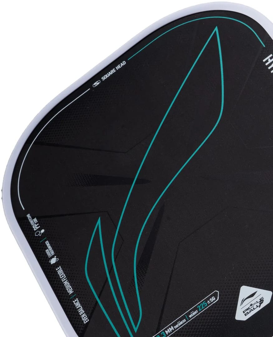 Close-up of the Li-Ning HyperControl 5 Pickleball Paddle by Li-Ning, featuring a black carbon fibre face with blue-green accents, white edging, and technical details—including “SQUARE HEAD” and a geometric motif—printed on the surface. The paddle incorporates a polypropylene honeycomb core for enhanced performance.