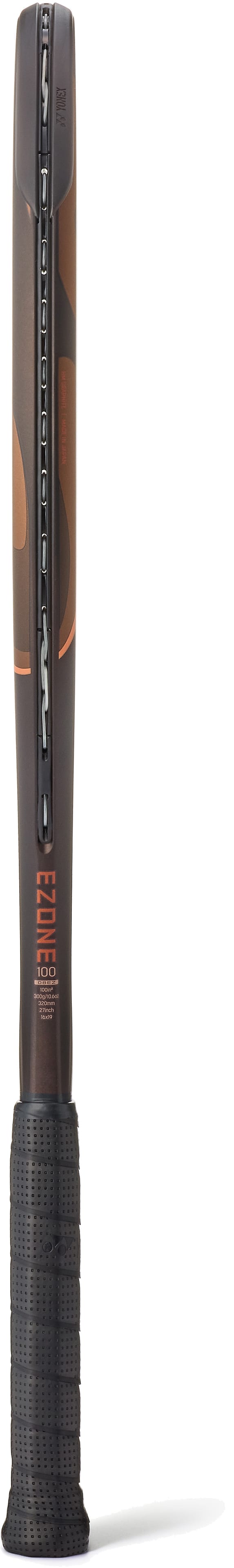 A close-up side view of the modern Yonex EZONE 100 Espresso Brown 2026 Tennis Racket reveals its black grip and dark espresso brown frame, showcasing the strings, part of the Yonex branding along the shaft, and highlighting its Vibration Dampening Mesh technology for enhanced comfort.