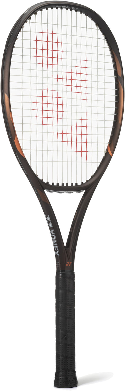 A Yonex EZONE 98 Espresso Brown 2026 tennis racket, featuring a wrapped handle and red logo on the strings, is displayed upright against a white background—ideal for advanced players seeking precision and power.