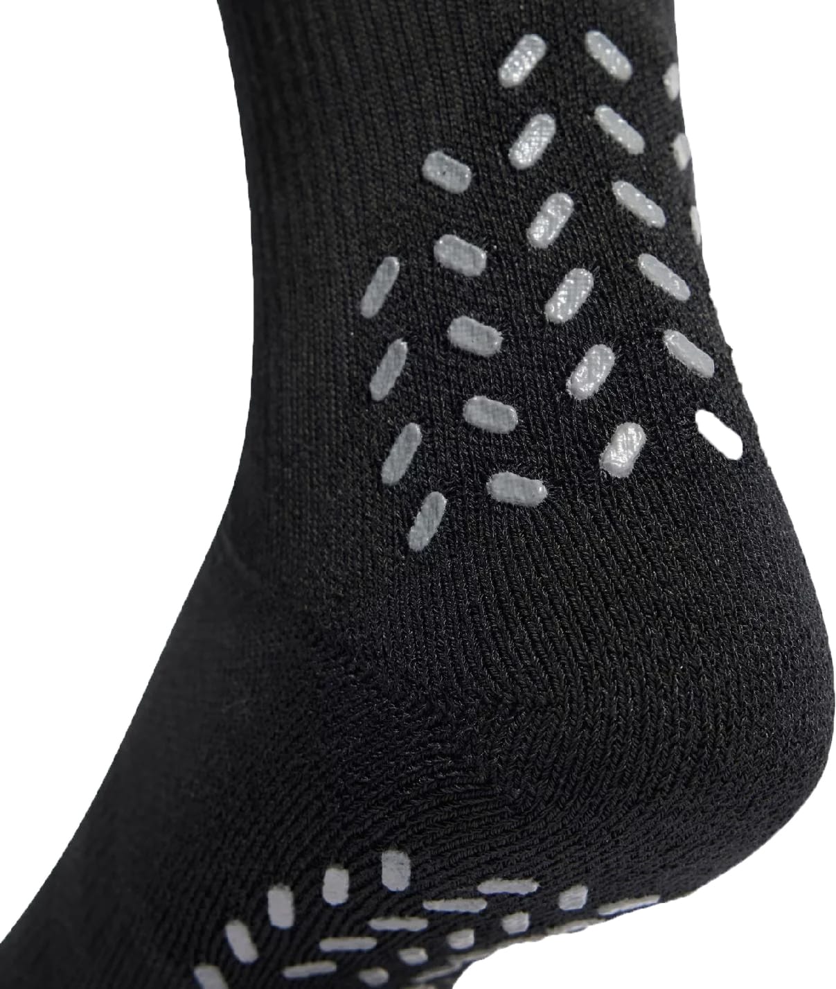 A close-up of the heel of the adidas Performance Cushioned Crew Grip Sports Socks in black, featuring white non-slip grip dots arranged in a pattern on the fabric.