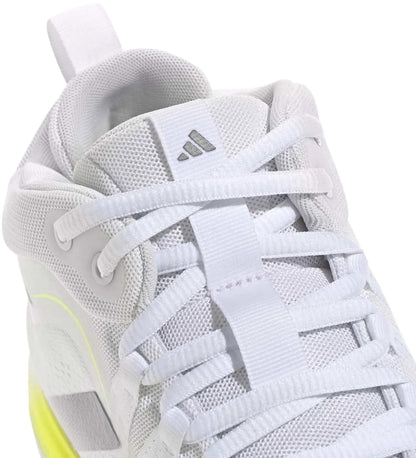 Close-up of the adidas Crazyflight 7 Men's Indoor Tennis Shoes in Cloud White/Iron Metallic, featuring mesh fabric, white laces, a grey adidas logo on the tongue, neon yellow side details, and responsive cushioning for comfort.