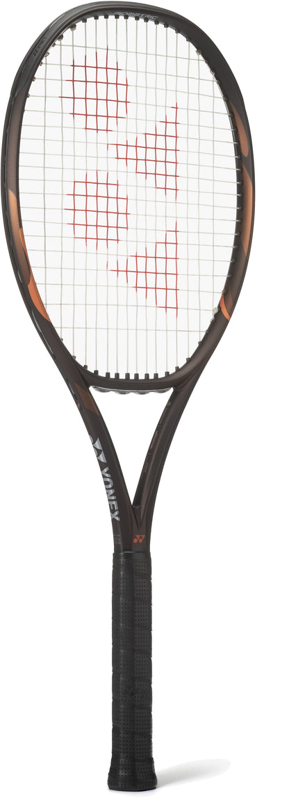 A Yonex EZONE 98 Tour Espresso Brown 2026 tennis racket with a red string pattern and white background, featuring the Yonex logo on the strings and frame. Enhanced with 2G-Namd Speed technology for improved power and responsiveness.