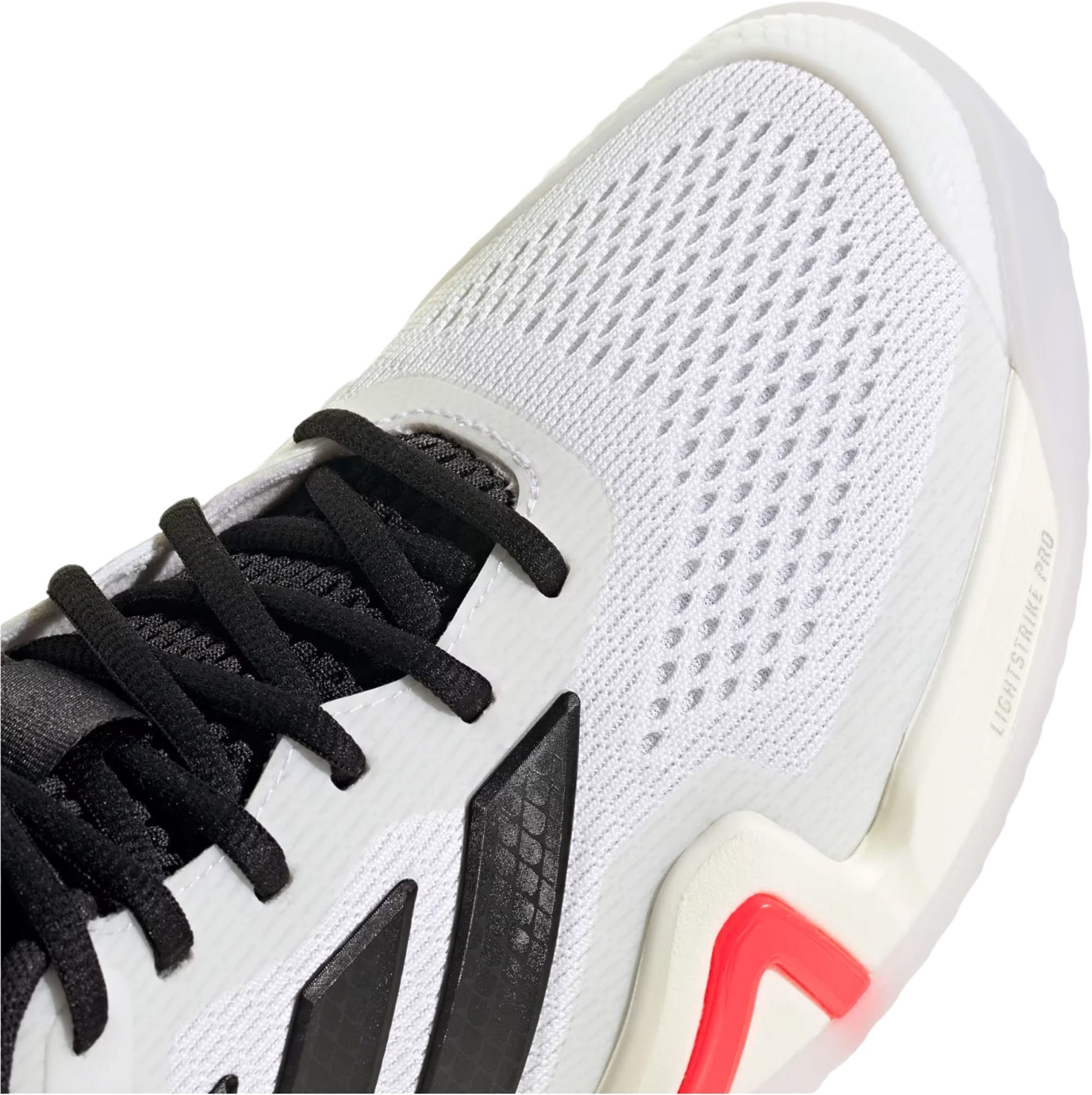 Close-up of the adidas Barricade 14 WIDE Men's Tennis Shoes in White, a hard-court model with black laces, red and black details, a mesh upper, and "LIGHTSTRIKE PRO" on the sole—highlighting its wide fit tennis shoe design.