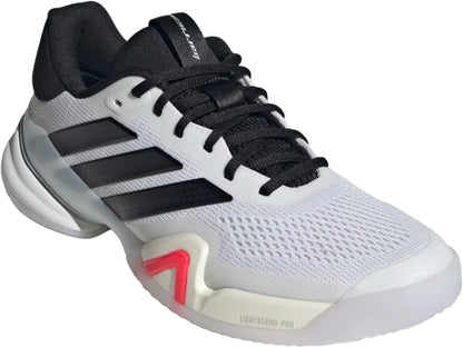 The adidas Barricade 14 WIDE Men's Tennis Shoes in white feature black laces, black accents, three black stripes, a mesh upper, and a thick white sole with a red midsole detail—ideal wide tennis shoes for hard courts.