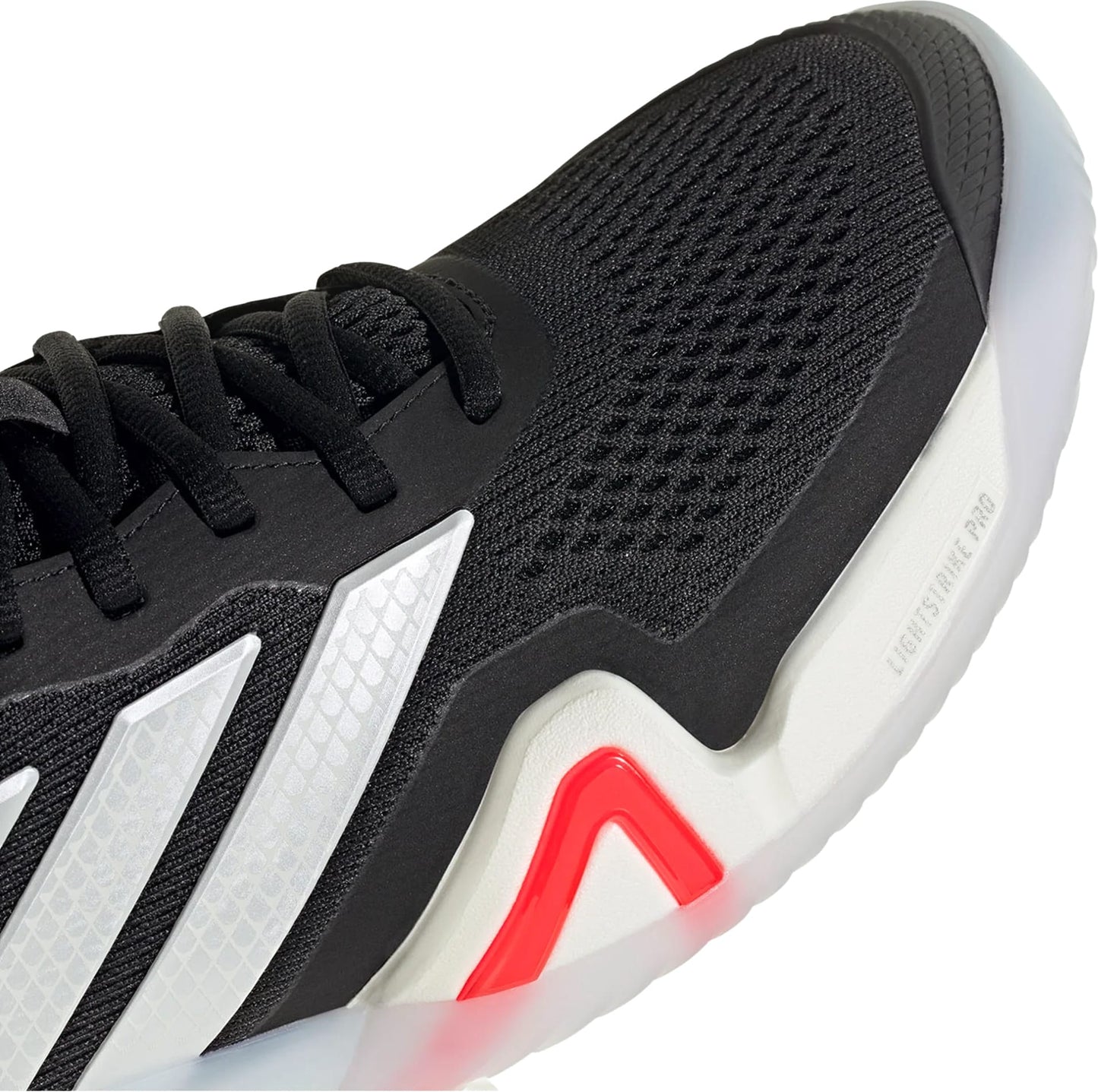 Close-up of the adidas Barricade 14 Men's Tennis Shoes—black with a white sole, textured stripes, breathable mesh upper, and a red Lightstrike Pro accent—delivering lightweight comfort ideal for hard-court play.