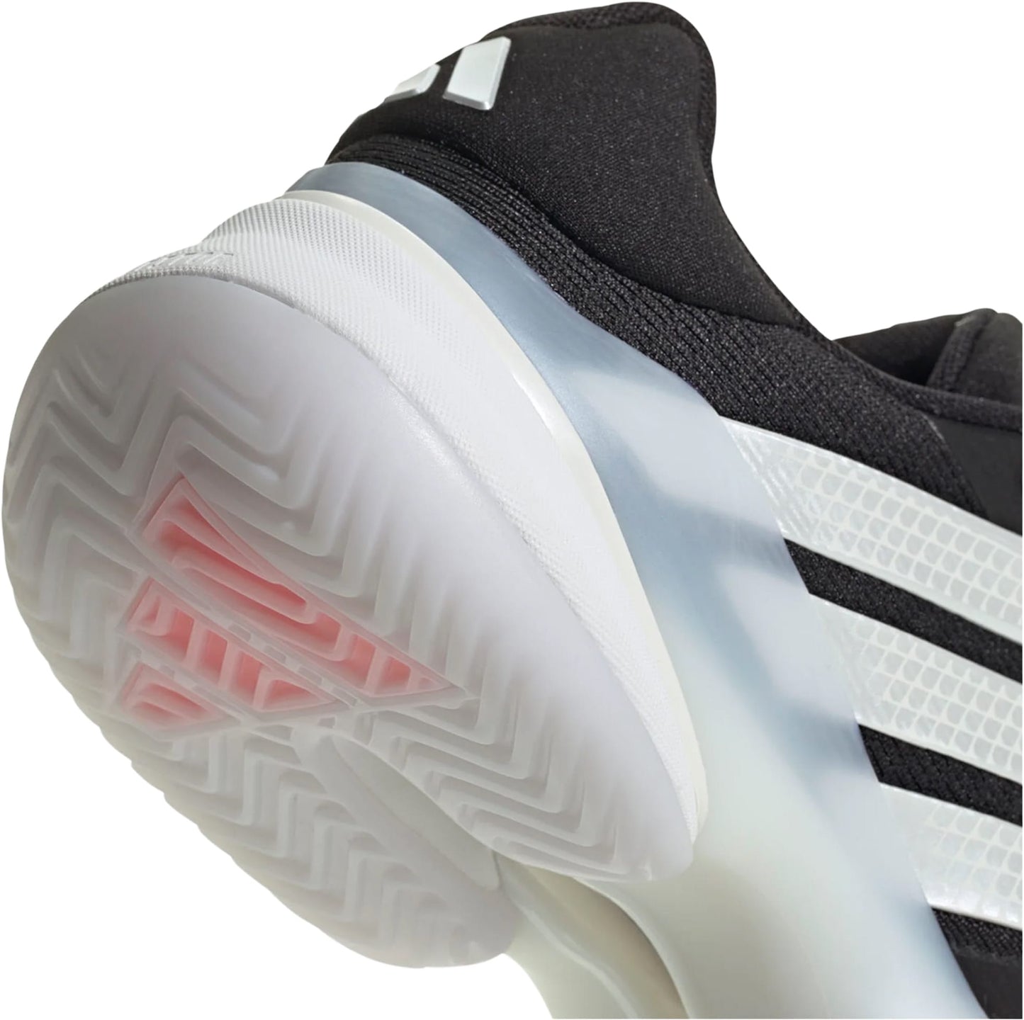 Close-up of the adidas Barricade 14 Men's Tennis Shoe in black, featuring signature white stripes, a translucent white sole with a textured tread pattern, and subtle pink accents visible beneath the sole.