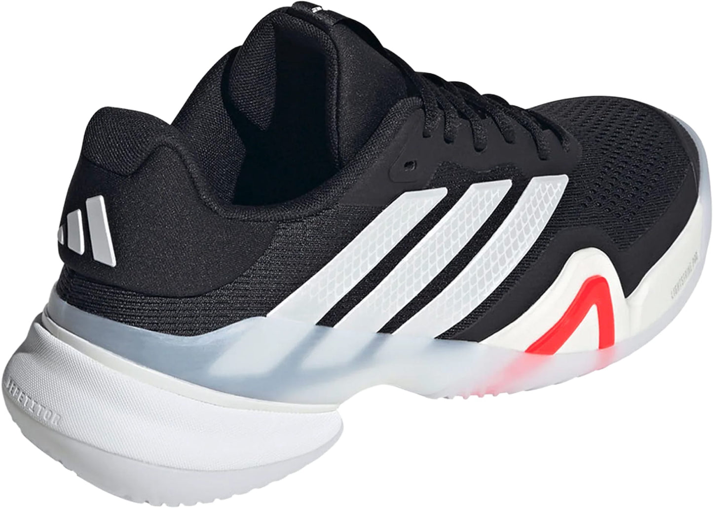 The adidas Barricade 14 Men's Tennis Shoes feature a black mesh upper with white stripes, a white and black sole, red midsole accents, and adidas branding on the heel, delivering a sporty look for hard-court play.